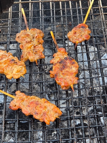 Fresh pork skewered on a charcoal. Thailand traditionally food, Thailand street food, pork are grill with sweet sauce.