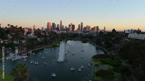 Echo Park Lake aerial pull back revealing downtown Los Angeles skyline at sunset, November 25, 2025