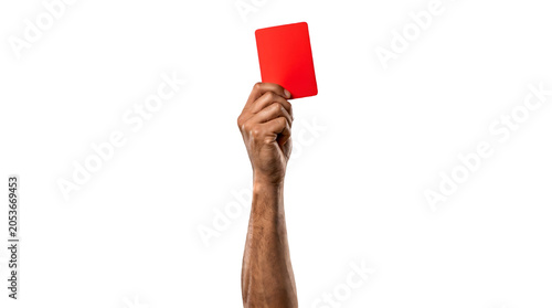 Close up of Referee Hand Holding Up a Red Card Isolated on Solid Black Background, Soccer Football Penalty or Disqualification Concept