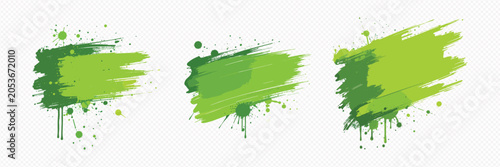 Green paint brush strokes and splatters on white background for creative design