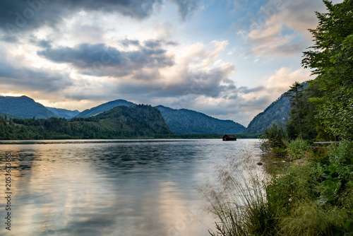 Canvas-taulu Calm Sunset at Almsee Lake With a Cabin Reflecting in the Water, Austria
