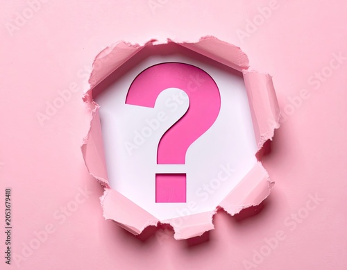 Pink paper torn revealing a large pink question mark on white