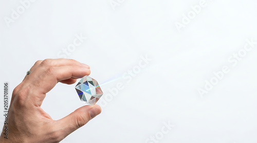 Hand holding laser prism white isolated on a clean white background