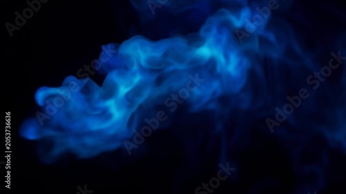 Vibrant blue neon smoke and wispy gas clouds swirling dynamically against dark empty space background. Magic energy and abstract chemical reaction concept