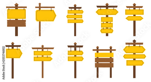 Set of wooden directional signposts with yellow boards