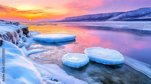 Frozen river at sunrise.  Vibrant colors paint the sky and ice