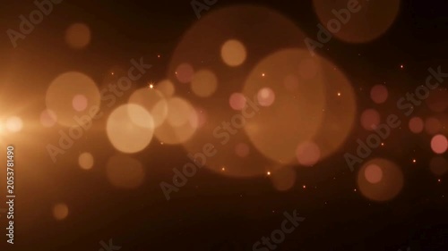 glowing golden bokeh lights and tiny sparkling particles 
