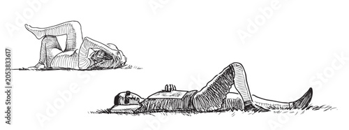 Valokuva Young people lying resting sleeping on grass lawn in city park on summer day, re