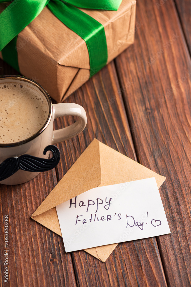 Fototapeta premium Celebrating Father's Day with coffee, gift, and a heartfelt card