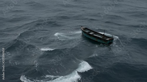 Small boat navigating open water creating wake in overcast conditions