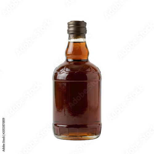 A single glass bottle filled with dark brown whiskey or rum liquor drink on a simple surface for display isolated on transparent background
