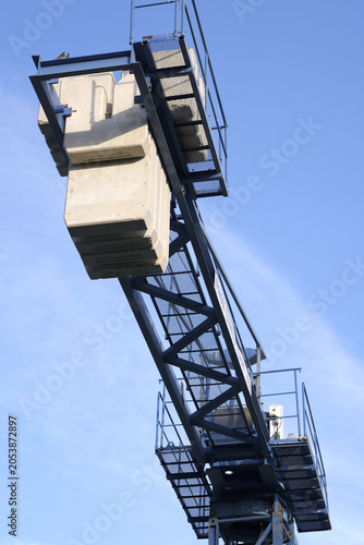 Canvastavla Construction crane jib arm with ballast weight against sky