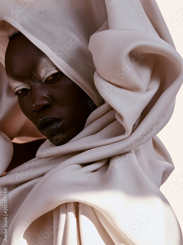 Avant garde fashion wrapped in sculptural fabric