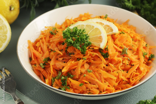 Vászonkép Salad Carrotes rapees - traditional French dish made of carrots