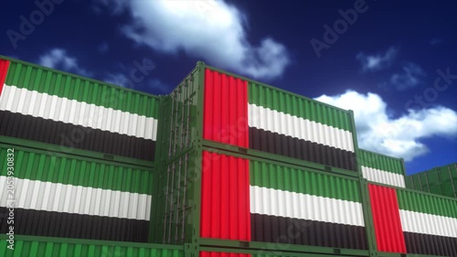 UAE Flag Colored Cargo Containers Stacked Under Bright Blue Sky
