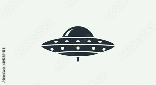Fotografie Black flying saucer with white dots.