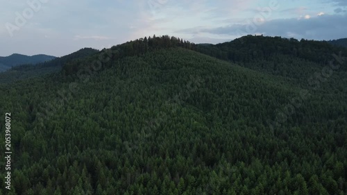 Aerial drone view of beautiful mountains at calm summer evening. Nature inspiration. Rural area on background summer landscape. Destination for tourism and wanderlust