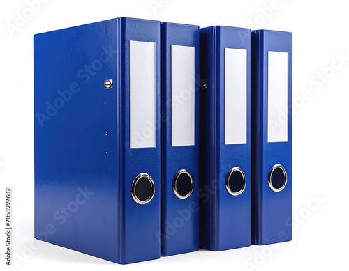 Four identical blue ring binders with white label holders stand upright