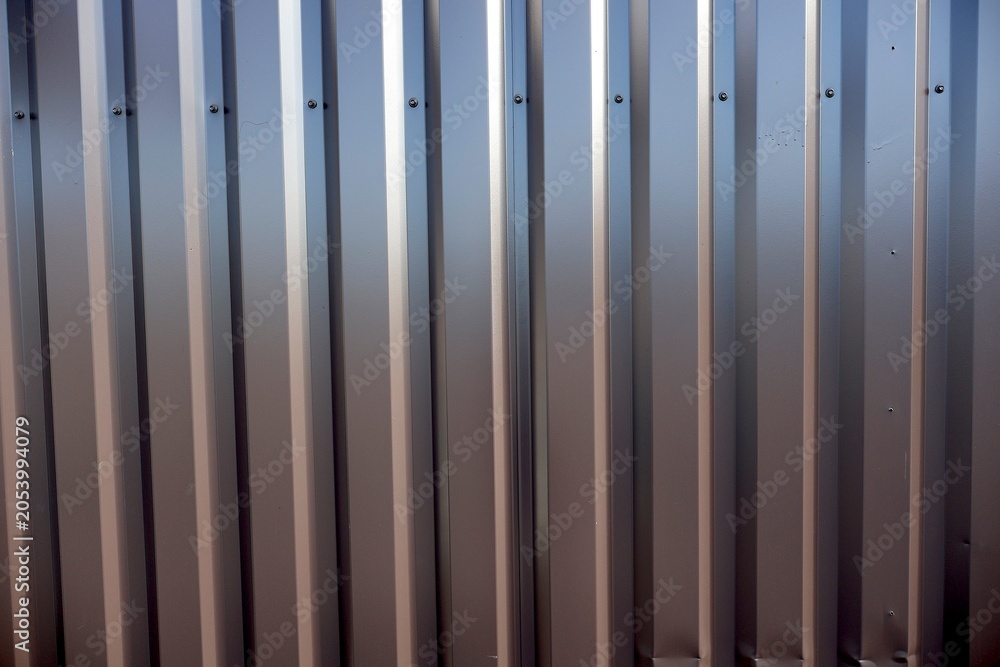 Obraz premium Vertical corrugated metal siding panels.