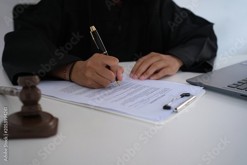 Fotografie Lawyers or advocates signing consent documents, concepts of justice, corporations, justice and rights, insurance, courts and authorities