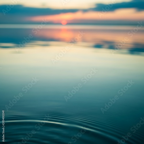 Serene Lake at Sunset - Ripples and Reflections of Tranquility.