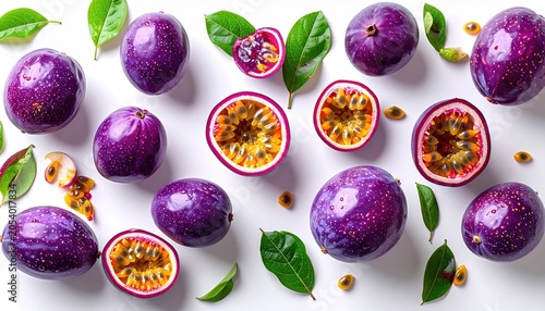 Vibrant purple fruits with juicy, seeded interior, scattered with green leaves