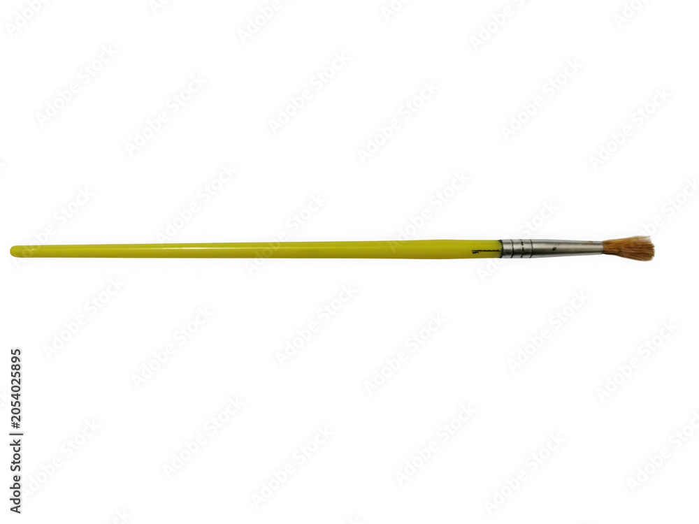 Fototapeta premium Yellow paintbrush with wooden handle and bristles