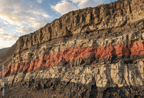 Konstfotografi Close up view of a steep geological cliff side showing clearly defined sedimenta