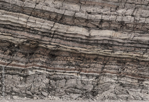 Slika na platnu Close up of layered sedimentary rock face showing distinct horizontal strata wit