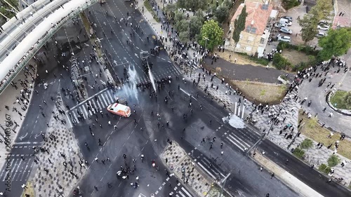 Aerial view Ultra Orthodox Protest Against Military Draft Jerusalem

Drone footage of ultra Orthodox protest near Chords Bridge, Cannon Dispersing Draft Protest Jerusalem, Israel, 1 June 2026.

