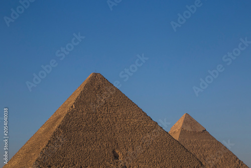 Great pyramid and pyramid of Chephren at Giza against clear blue sky