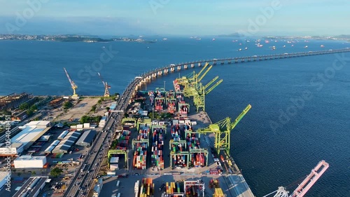 Aerial View of Docks Area Full of Containers in Rio de Janeiro City Port and The Bridge To Niteroi Crossing Guanabara Bay