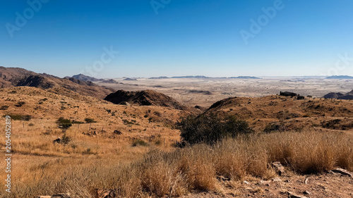 Daytime views of the Namib Deserts dry grass and mountains, Namibia