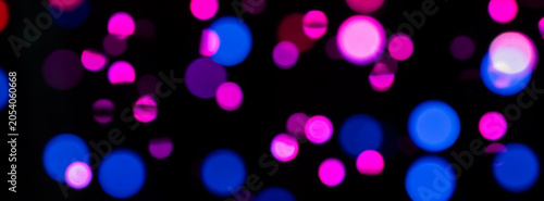 Foto Vibrant Bokeh Lights in Pink, Purple, and Blue Creating a Nighttime Festive Mood