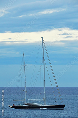 A lonely yacht with two masts