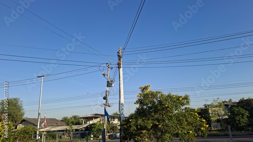 Power Lines and Clear Blue Sky in Suburban Area