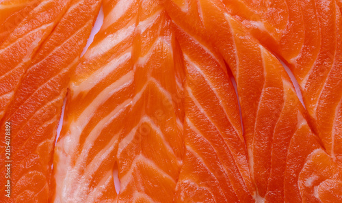 Fresh Raw Salmon Fillet Texture Background,Macro,A high-quality close-up texture shot of vibrant, fresh raw salmon slices, showcasing the natural marbled fat patterns and deep orange-pink color,