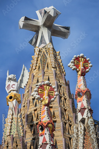 La Sagrada Familia - impressive cathedral designed by Gaudi. Tower, dedicated to Jesus Chris with huge three-dimensional four-pointed cross. BARCELONA, SPAIN.