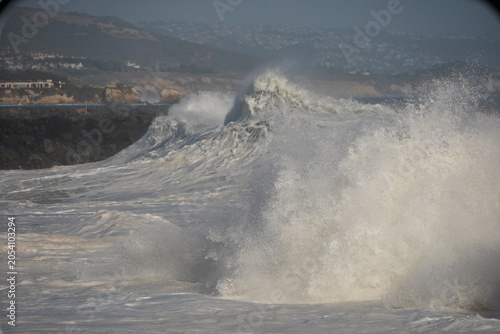 Huge swell waves exploding on the shore at The wedge