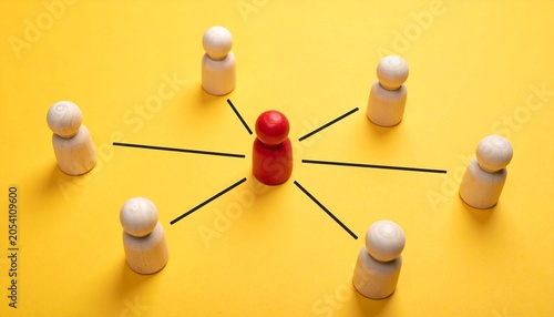 Leadership, Centralized Communication, and Team Networking Concept with red figure in mid of white figures on yellow background 