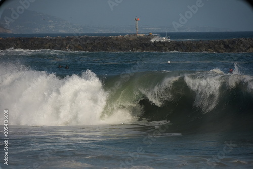 Waves exploding on the sand at the wedge