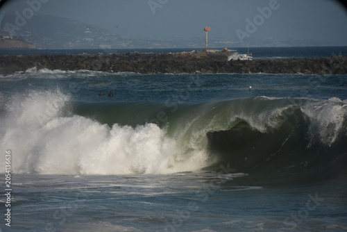 Giant swell barrels breaking at the wedge