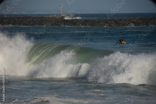 Giant swell barrels breaking at the wedge