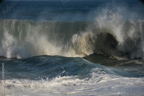 Giant swell barrels breaking at the wedge