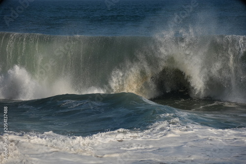 Giant swell barrels breaking at the wedge