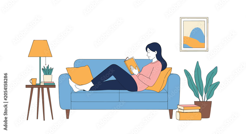 Obraz premium Young woman relaxing on a blue sofa while reading an interesting book in a cozy living room decorated with houseplants and a stylish lamp.