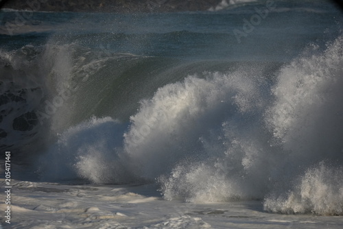 Bild auf Leinwand Giant shorebreak crashing on the sand at the wedge