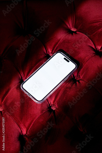 Mock-up phone with empty screen on red velvet background