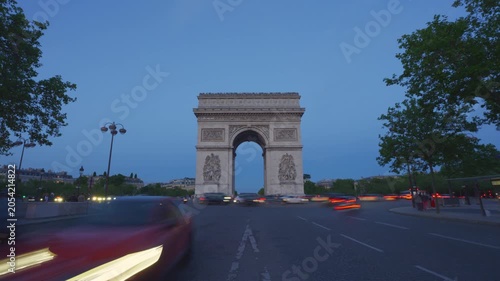 Time lapse shot of arc de triomphe in paris france at dusk.
