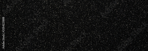 Foto Abstract black background covered with small white sparkling dots